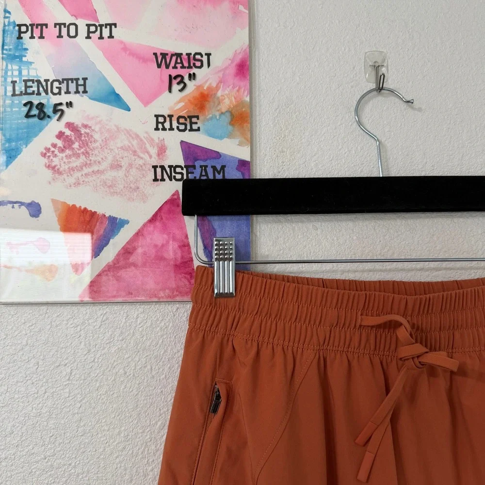 Athleta A-Line Midi Skirt 4 Womens Burnt Orange Zipper Pockets Elastic Earthy